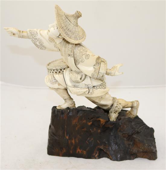 A Japanese sectional ivory figure of a fisherman, Meiji period, height 26.8cm, rod lacking